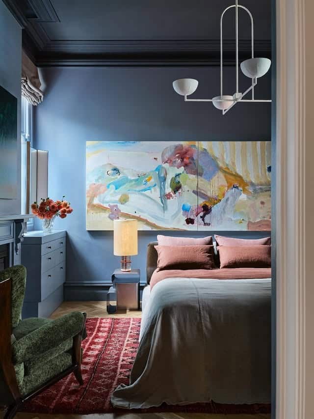 7. Artful Blue Bedroom with Warm Earthy Contrast - gray and blue bedroom ideas