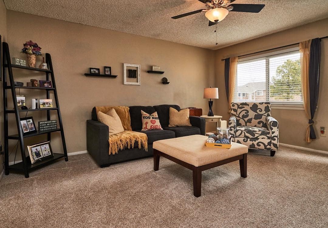 8. Cozy Traditional Charm - brown and gold living room ideas