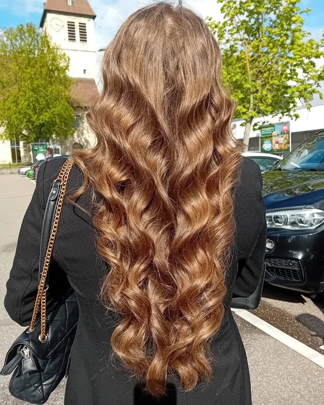 3. Rich Honey Blonde with Voluminous Curls - Dark Blonde Hair Color