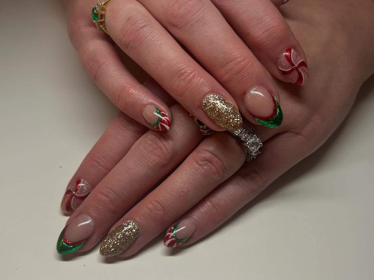 1. Golden Candy Cane Elegance - red and green nail ideas