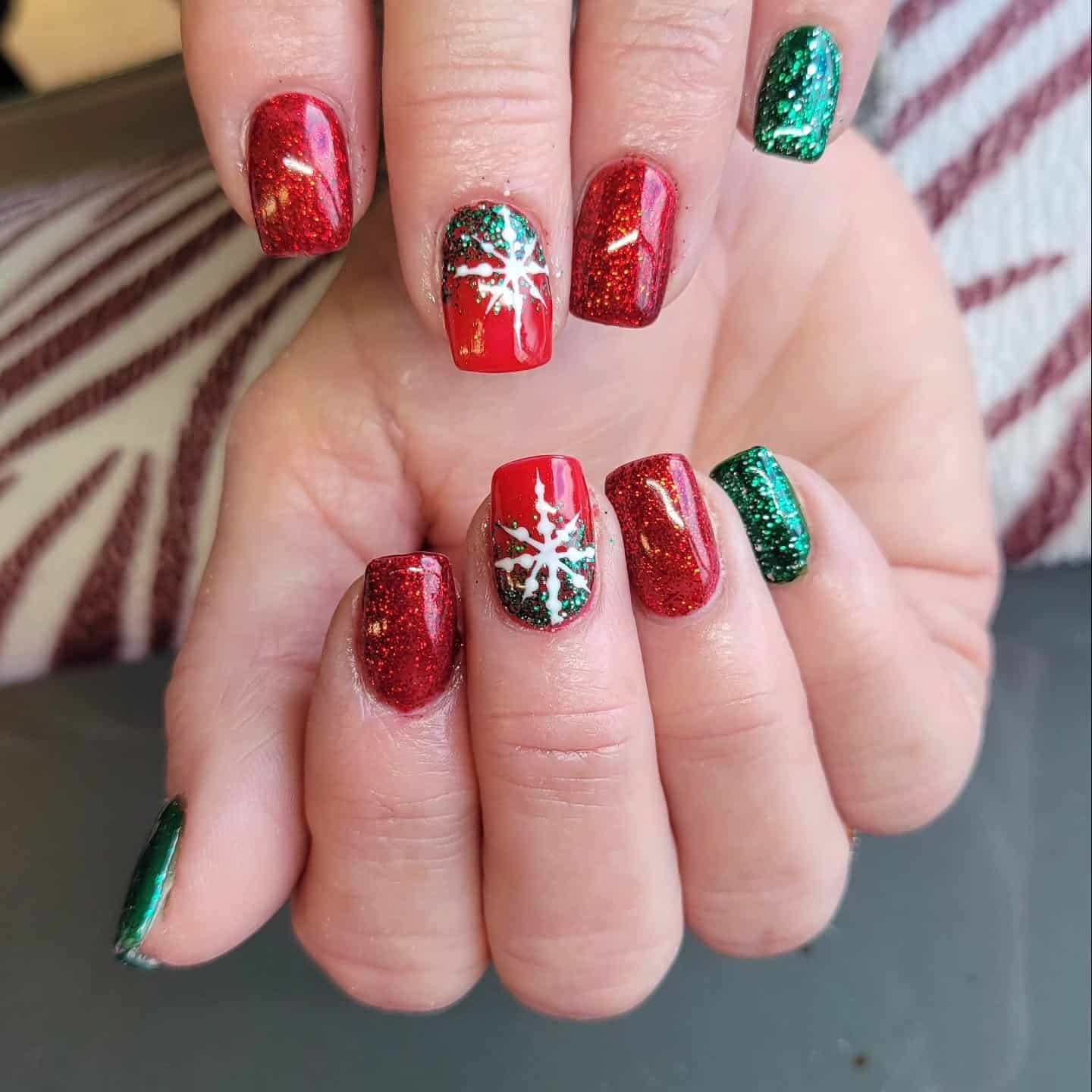 9. Glitter Snowflake Celebration - red and green nail ideas