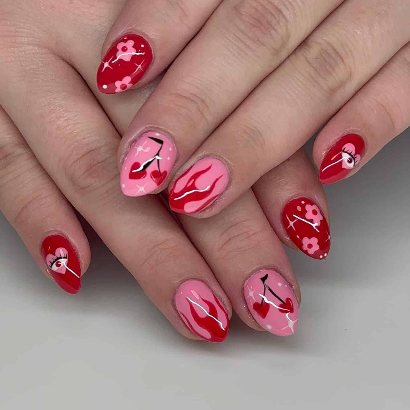 3. Cherry Kissed Artistry - red and pink nail ideas