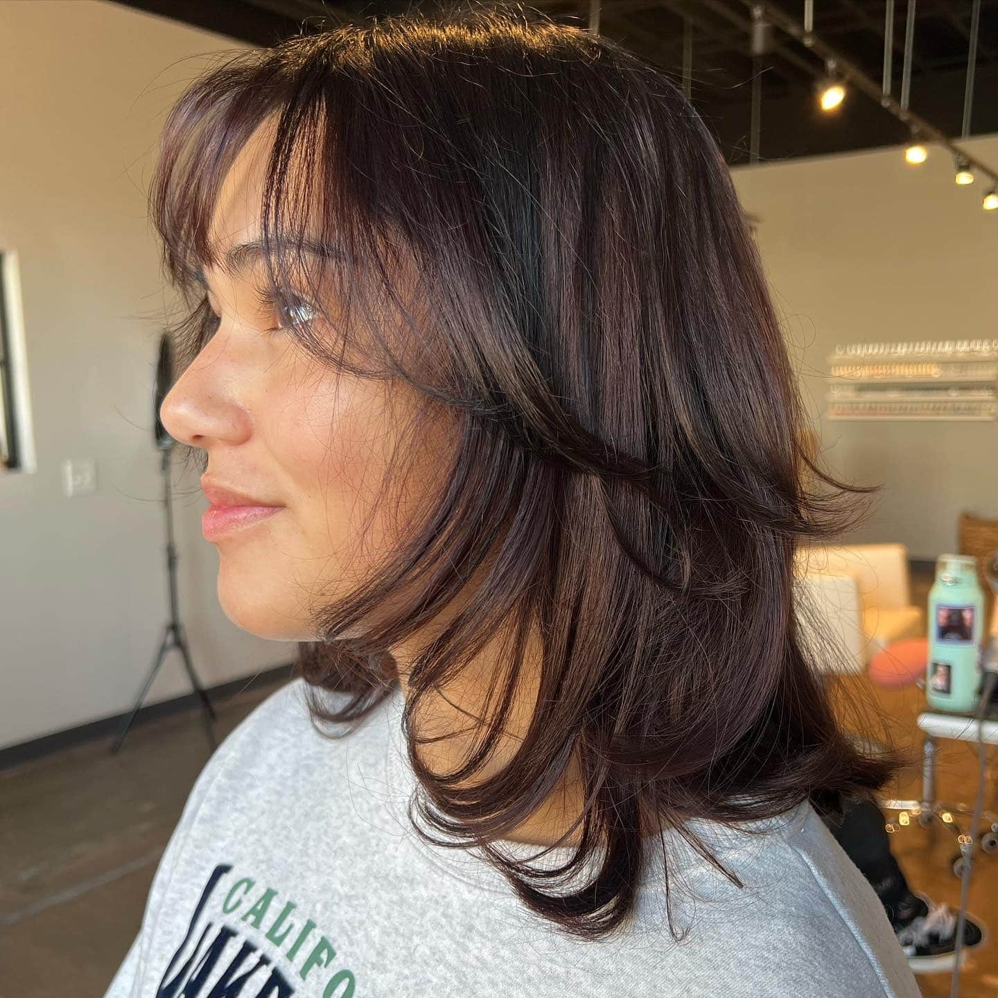 3. Textured Medium Layers with Curtain Bangs - Short Hair with Layers