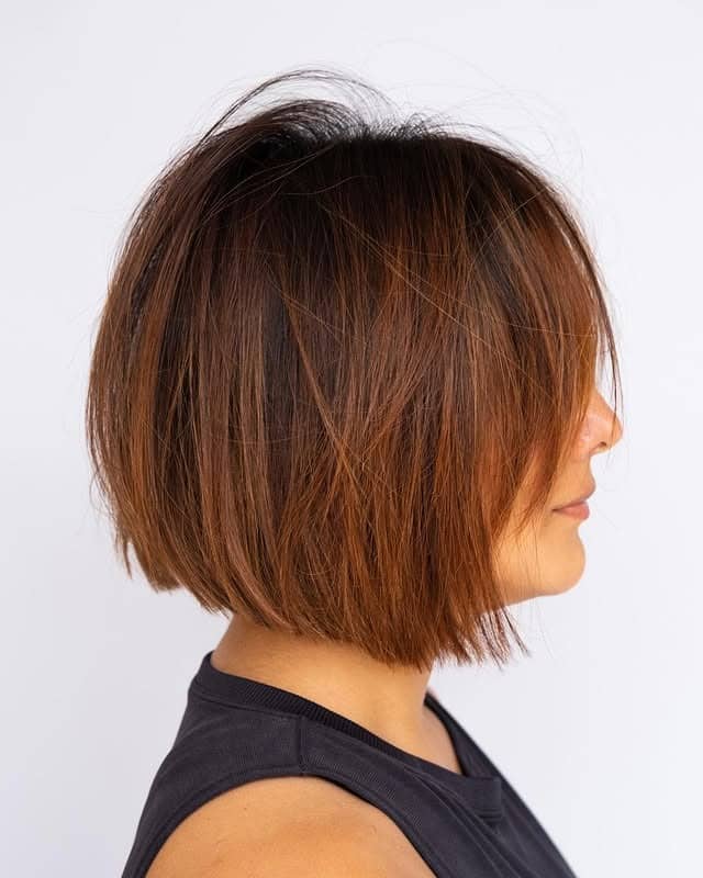 14. Sleek Blunt Bob with Copper Undertones - Short Hair with Layers