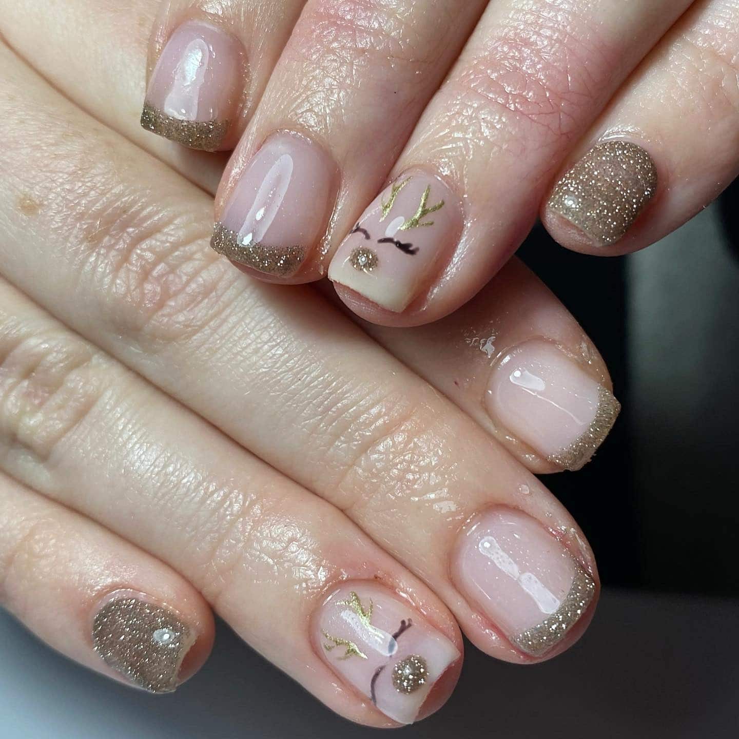 6. Golden Reindeer Minimalism - reindeer nail ideas