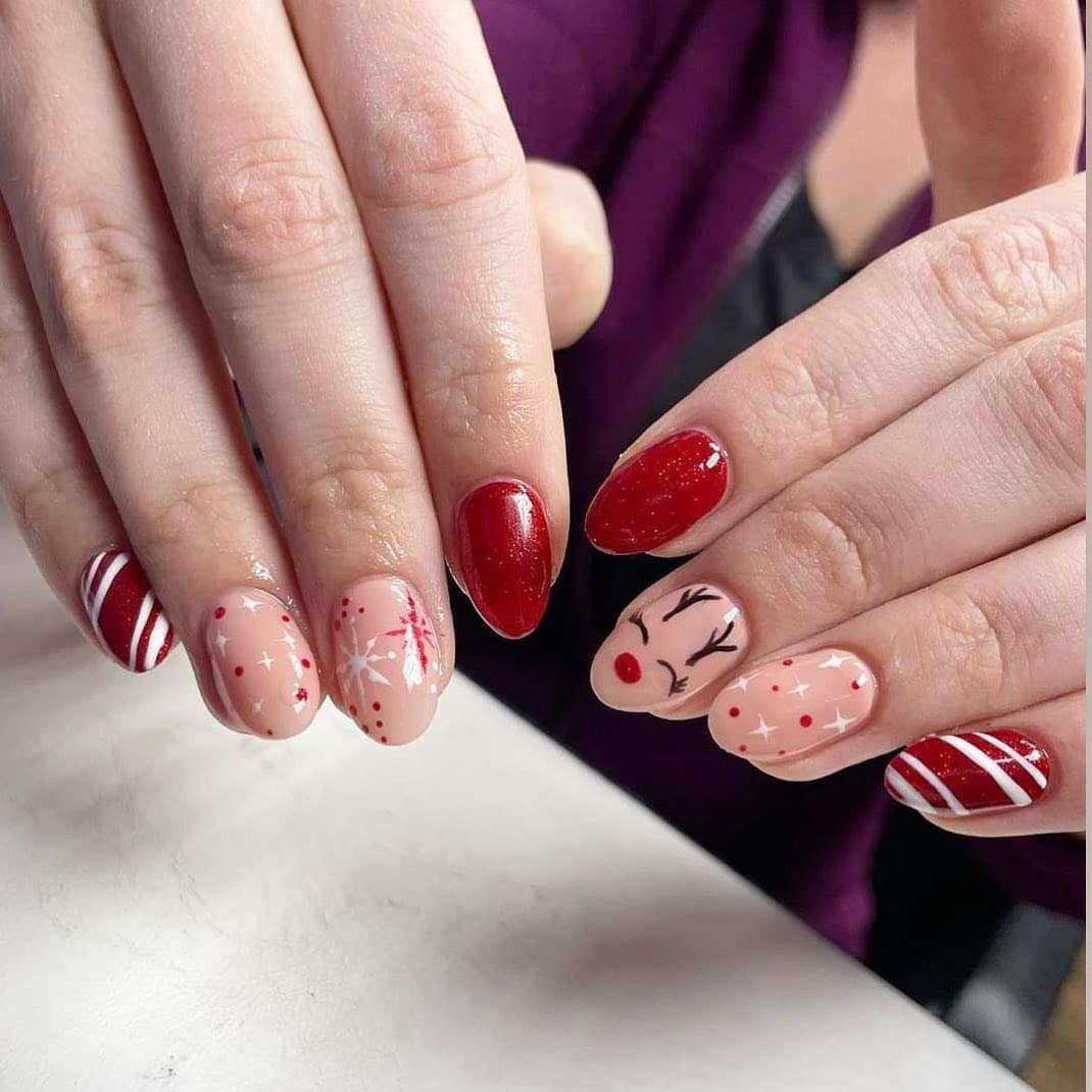 10. Red Sparkle & Reindeer Sweetness - reindeer nail ideas