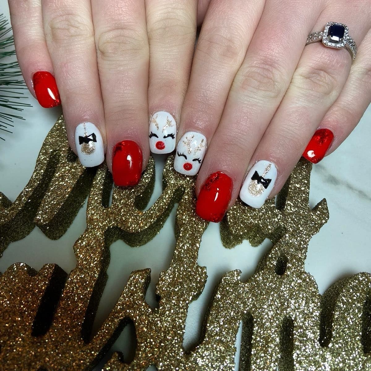 11. Red & White Rudolph Glamour - reindeer nail ideas