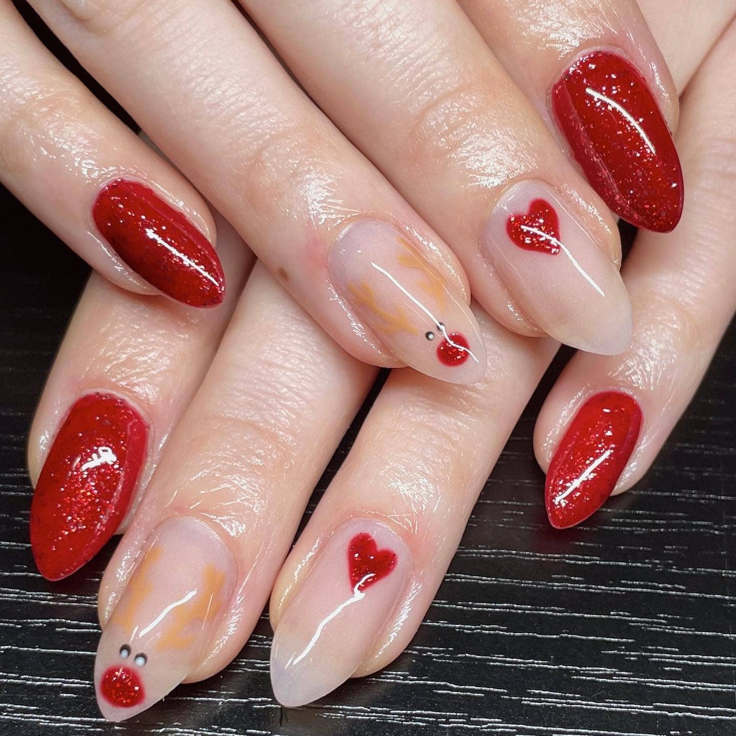 12. Minimal Rudolph & Scarlet Sparkle - reindeer nail ideas