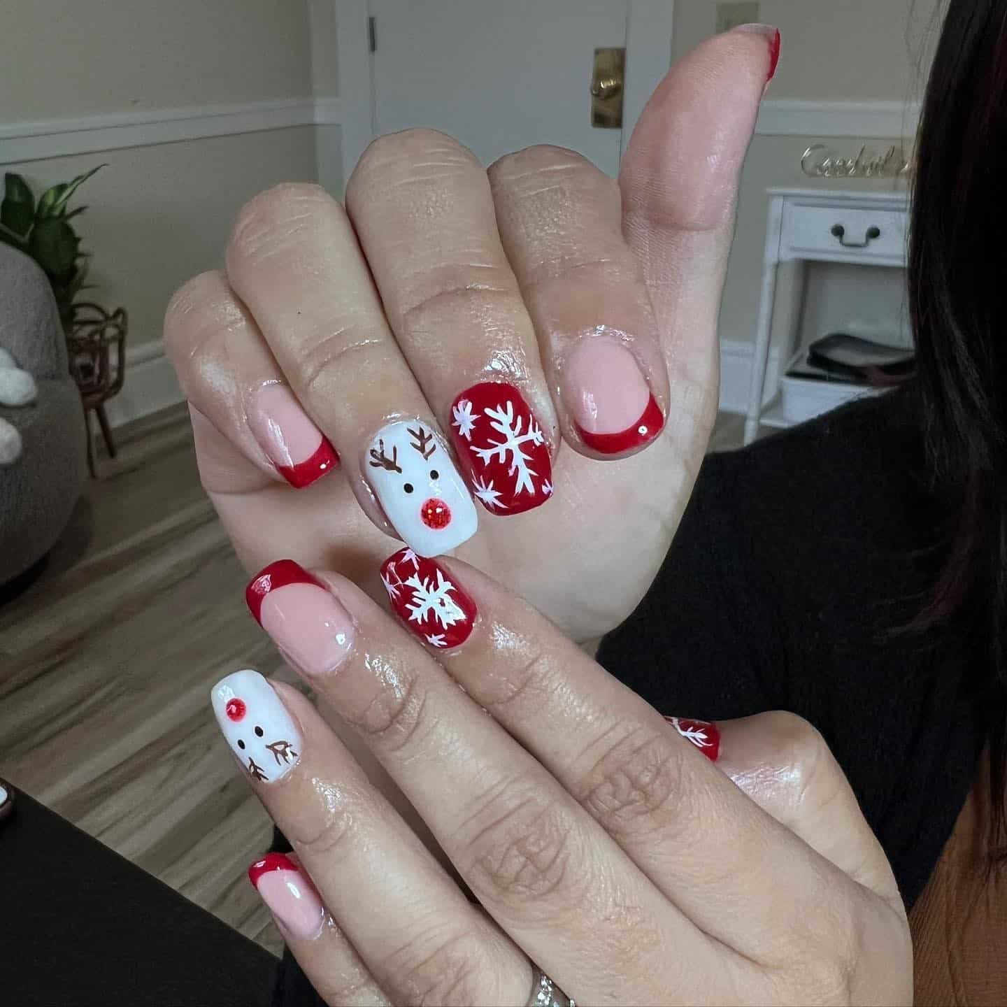 22. Classic Red French Reindeer Charm - reindeer nail ideas