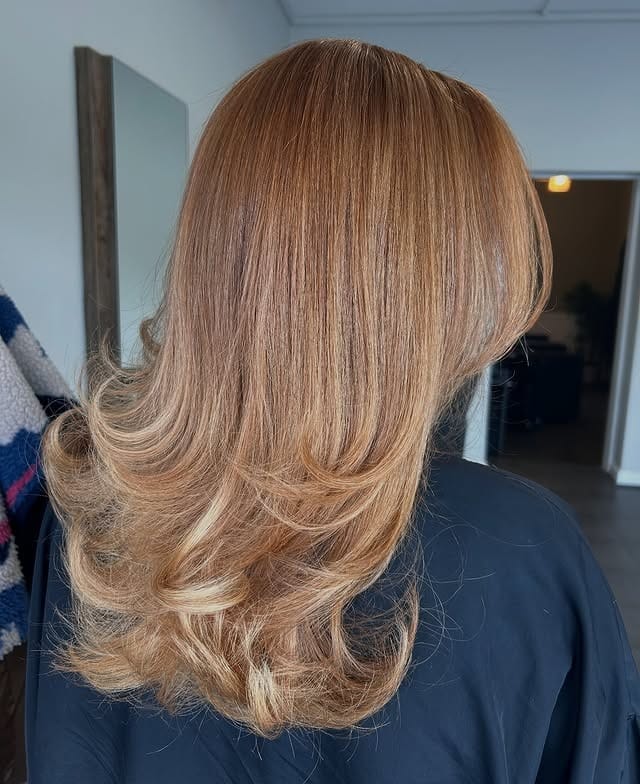 3. Feathered Caramel Strawberry Layers - Strawberry Blonde Hair Color