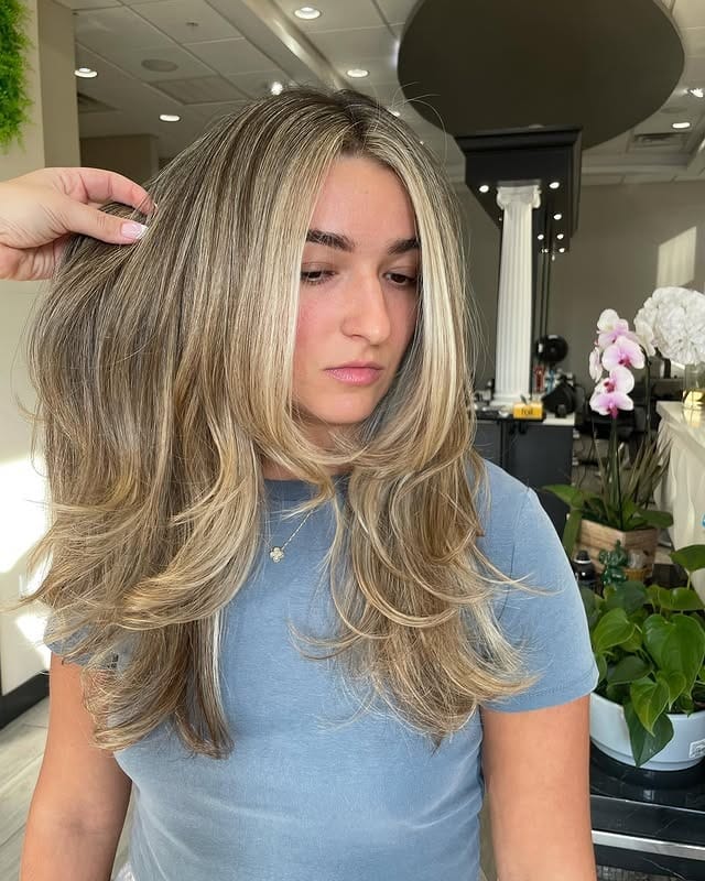 7. Buttercream Layered Blowout - Winter Hairstyles