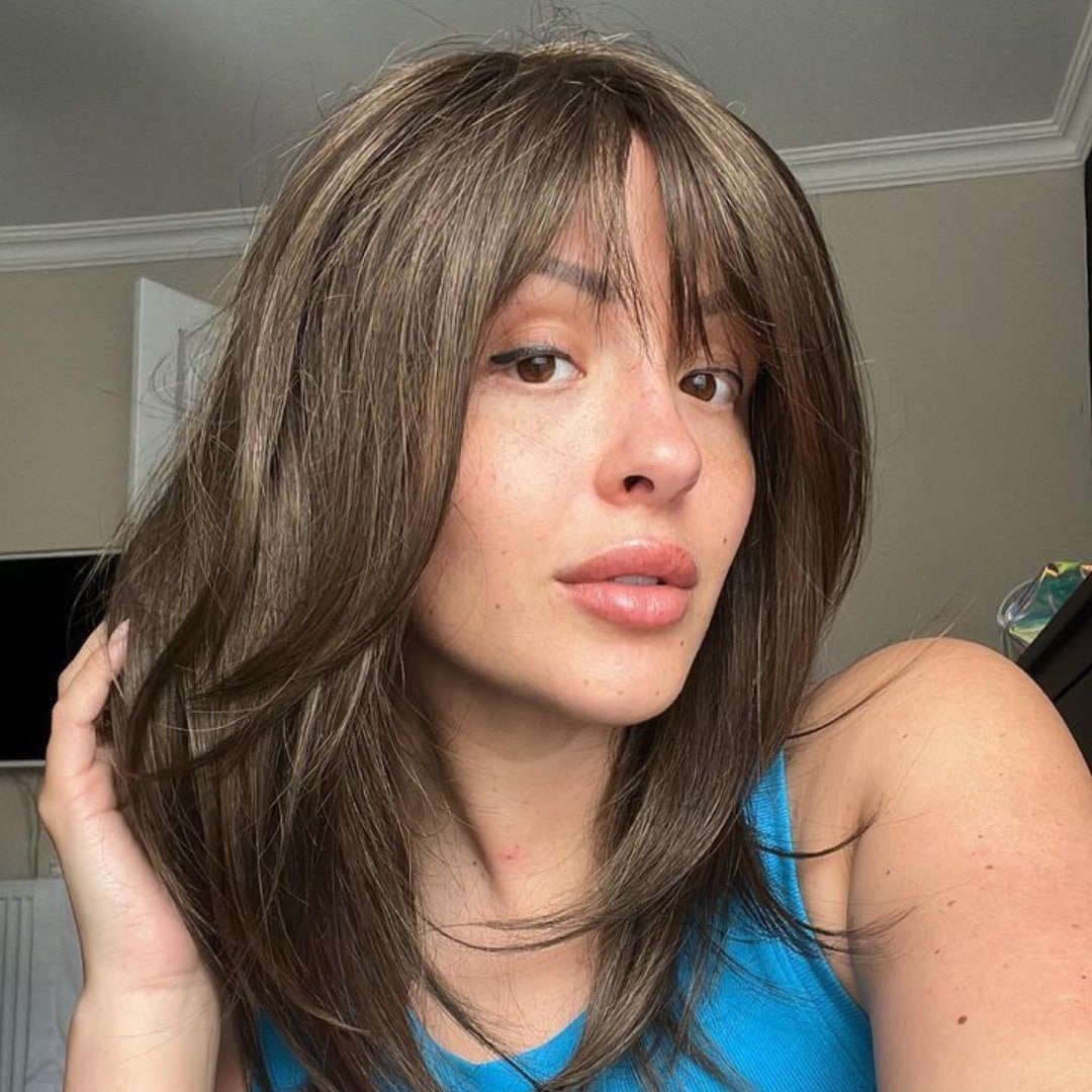 13. Smoky Mocha Shag with Curtain Bangs - Winter Hairstyles