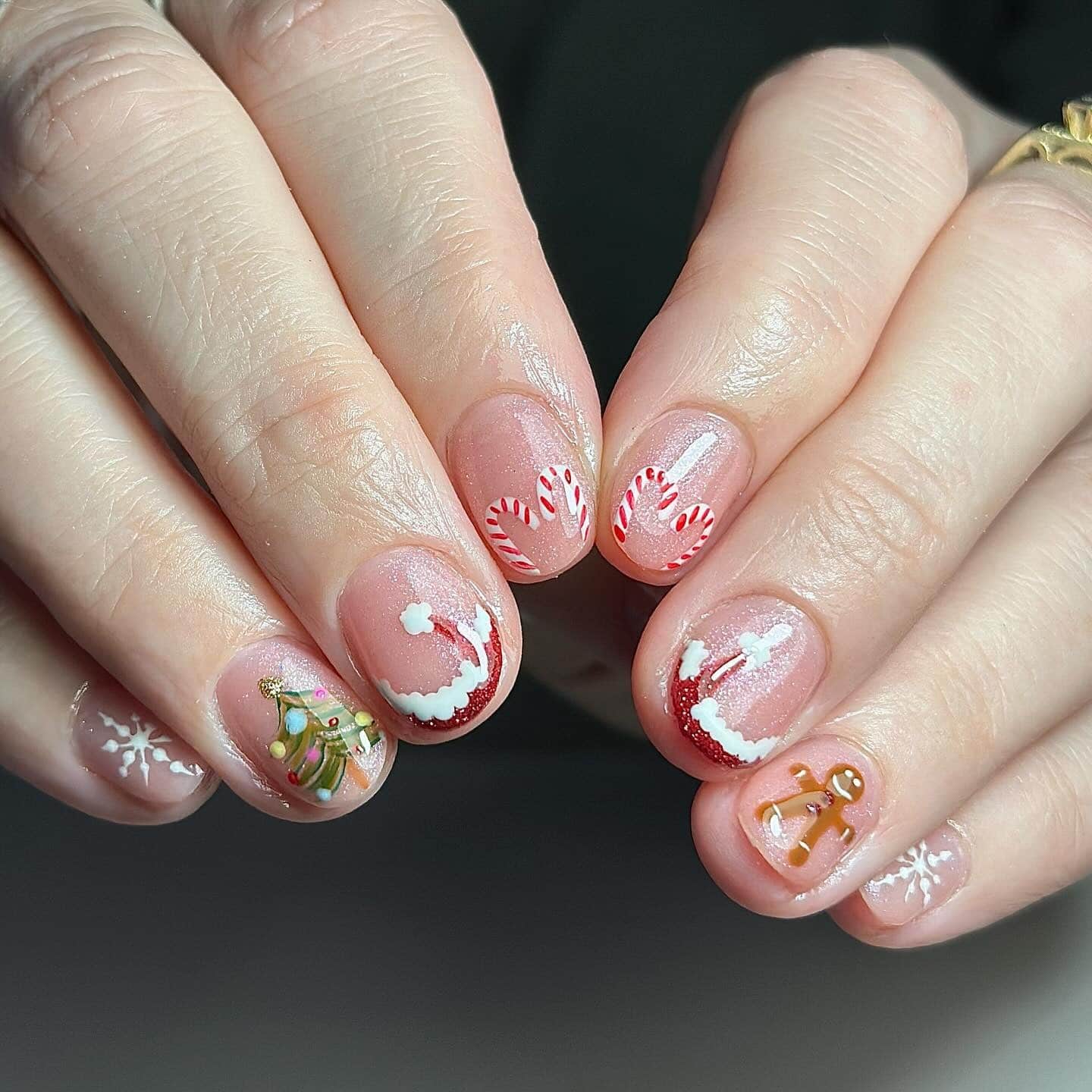 2. Candy Cane Delight - short christmas nail ideas