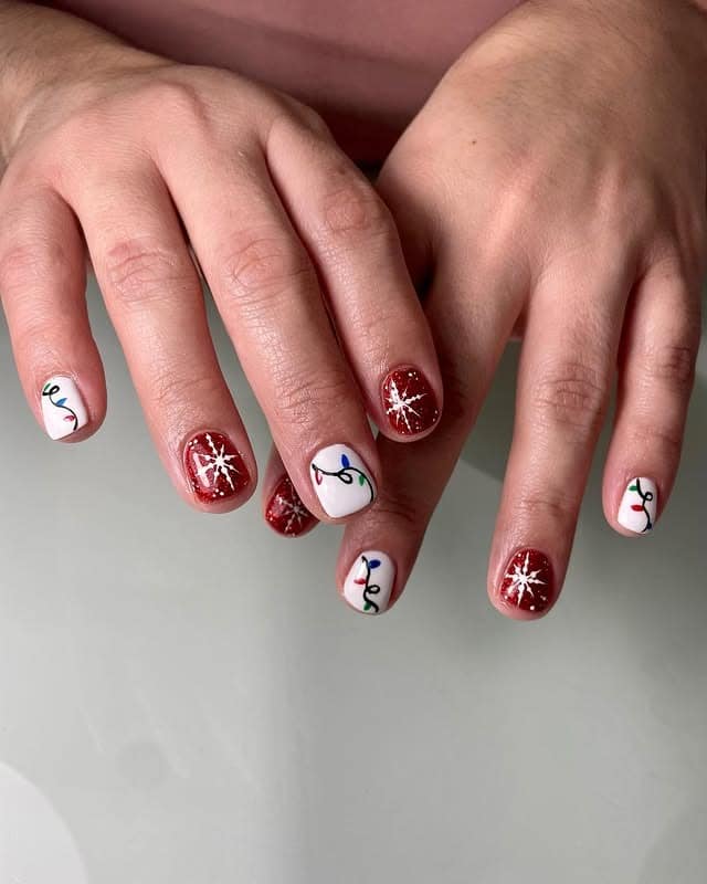 4. Twinkling Lights and Stars - short christmas nail ideas