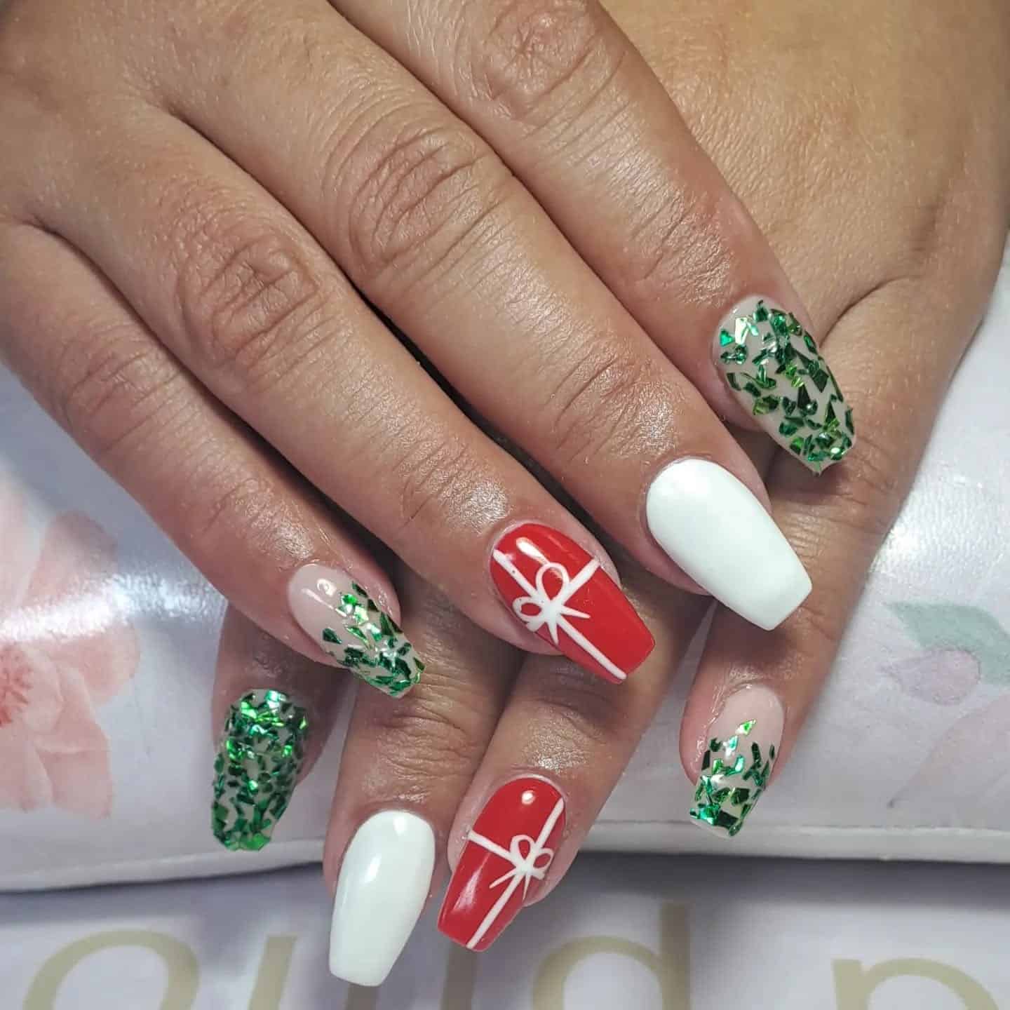 8. Gift Wrapped Elegance - short christmas nail ideas