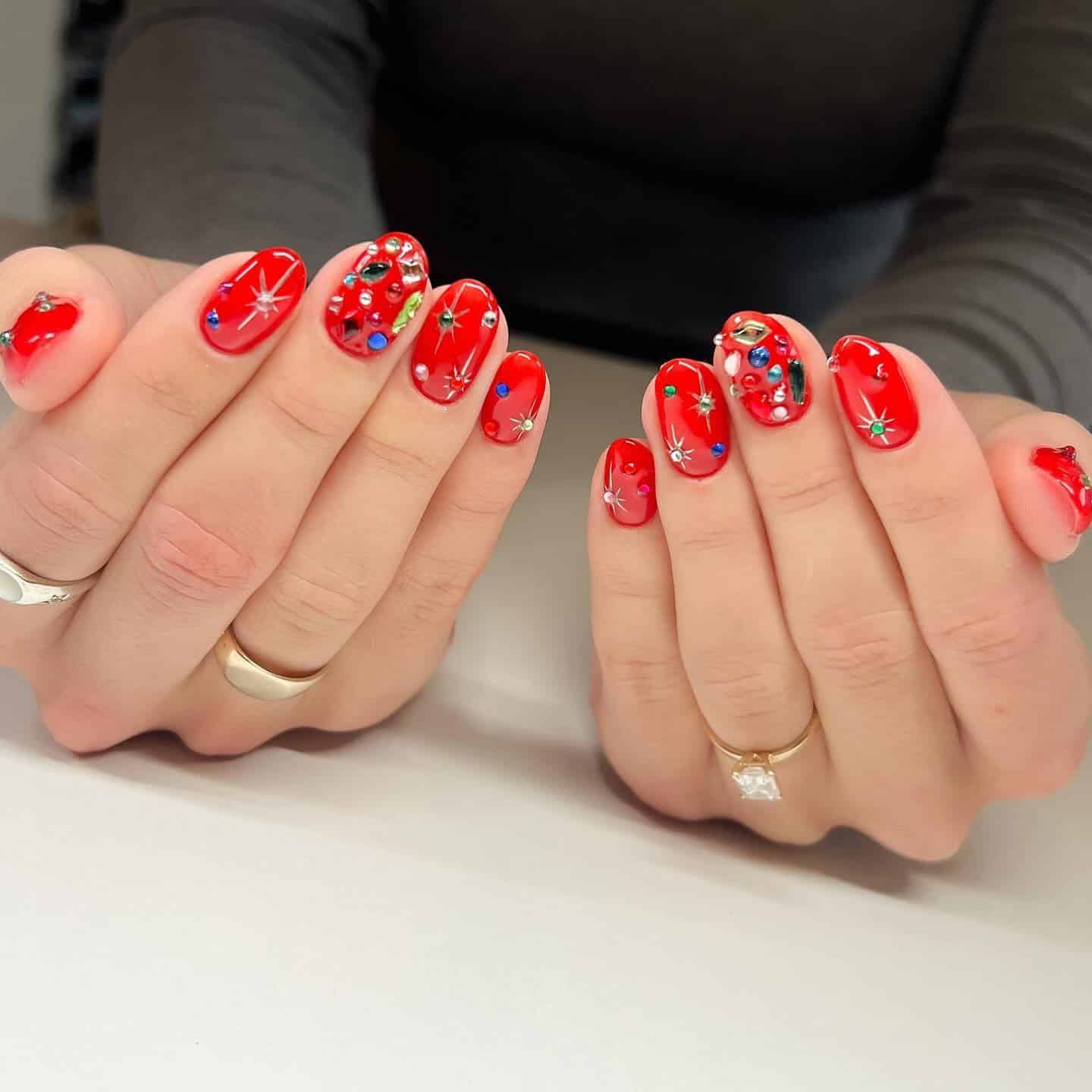 12. Jewel-Red Holiday Sparkle - short christmas nail ideas