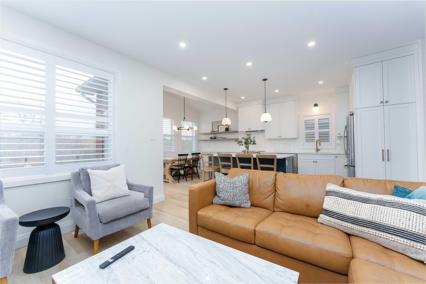 12. Modern Simplicity with Leather and Linen - open concept living room ideas