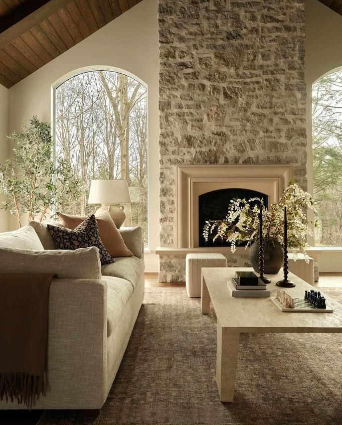 7. Organic Tranquility in Stone and Light - fireplace living room ideas