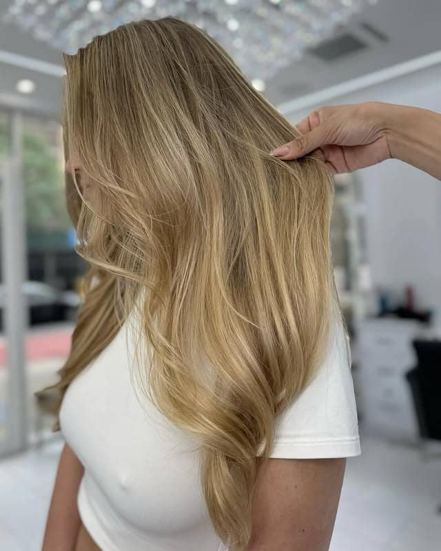 9. Sunlit Golden Balayage with Natural Flow - Blonde Highlights Hair Color