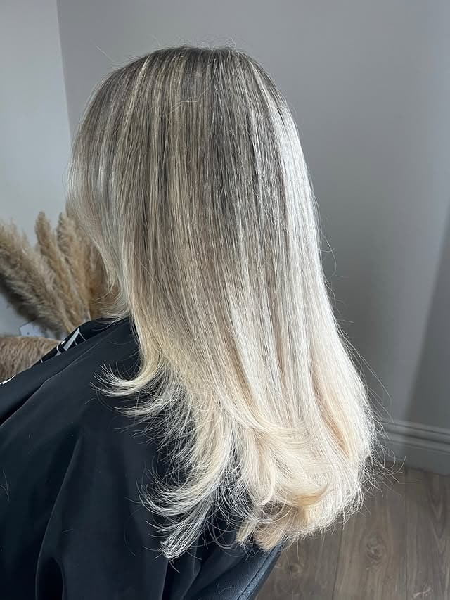 11. Soft Platinum Layers with Feathered Ends - Blonde Highlights Hair Color