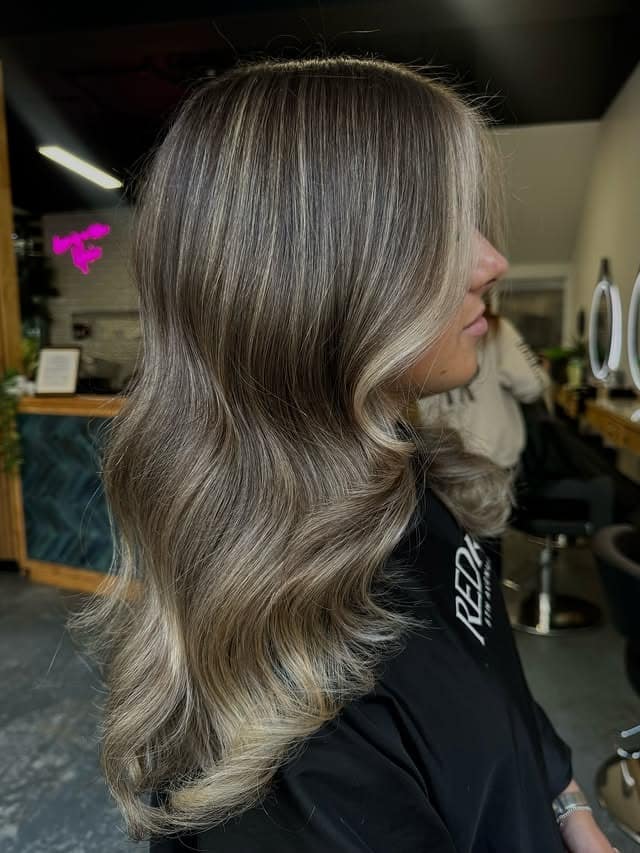 22. Smoky Beige Blonde with Glossy Hollywood Waves - Blonde Highlights Hair Color
