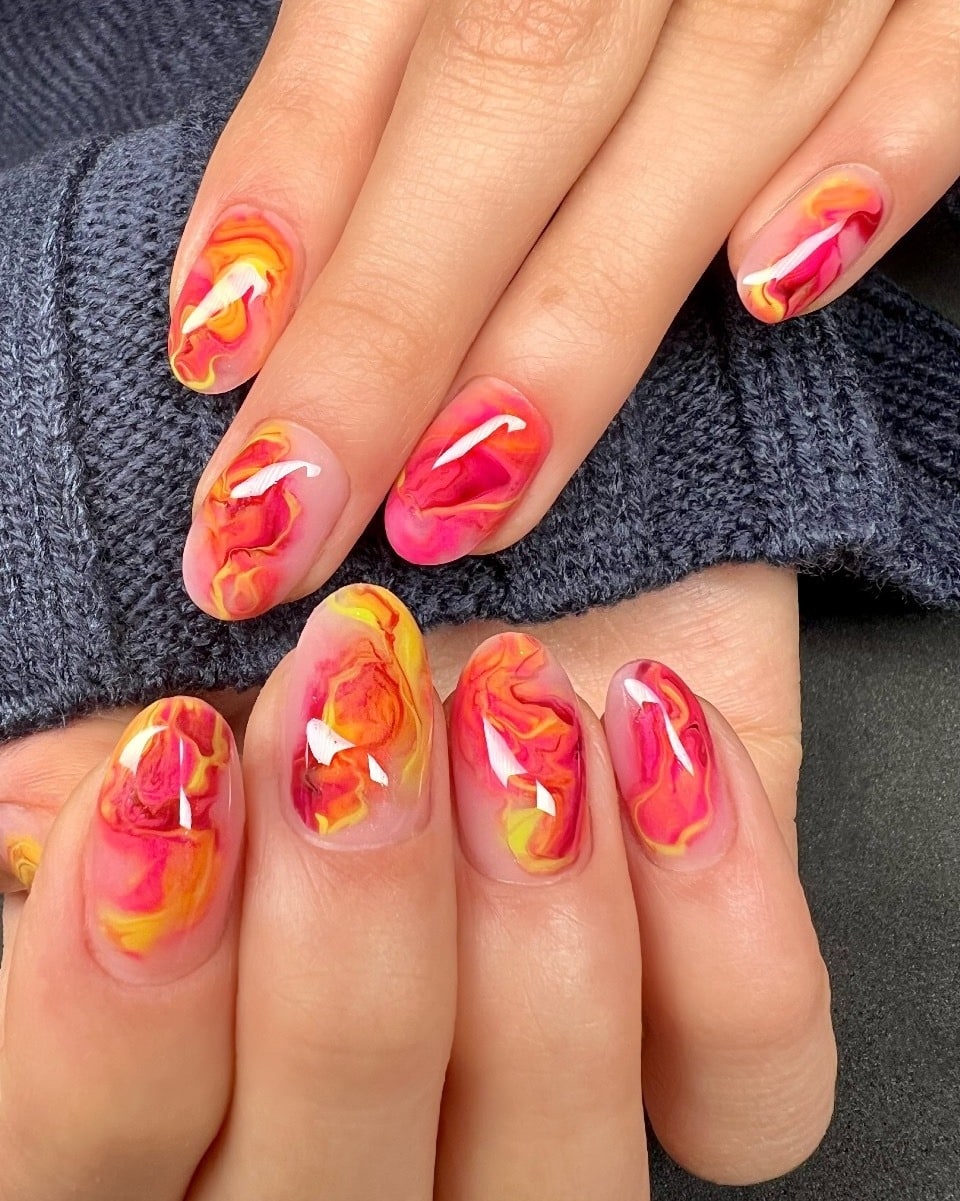 4. Fiery Marble Blend - short rounded nail ideas