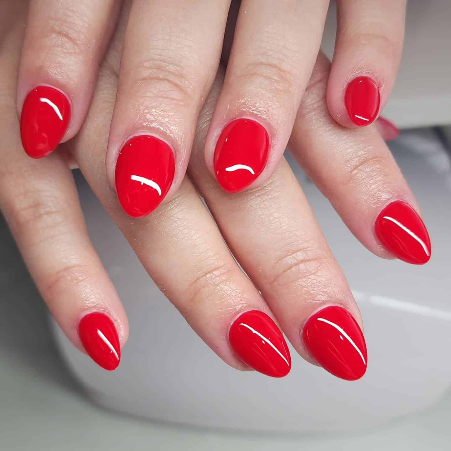 10. Classic Glossy Red Nails - short rounded nail ideas