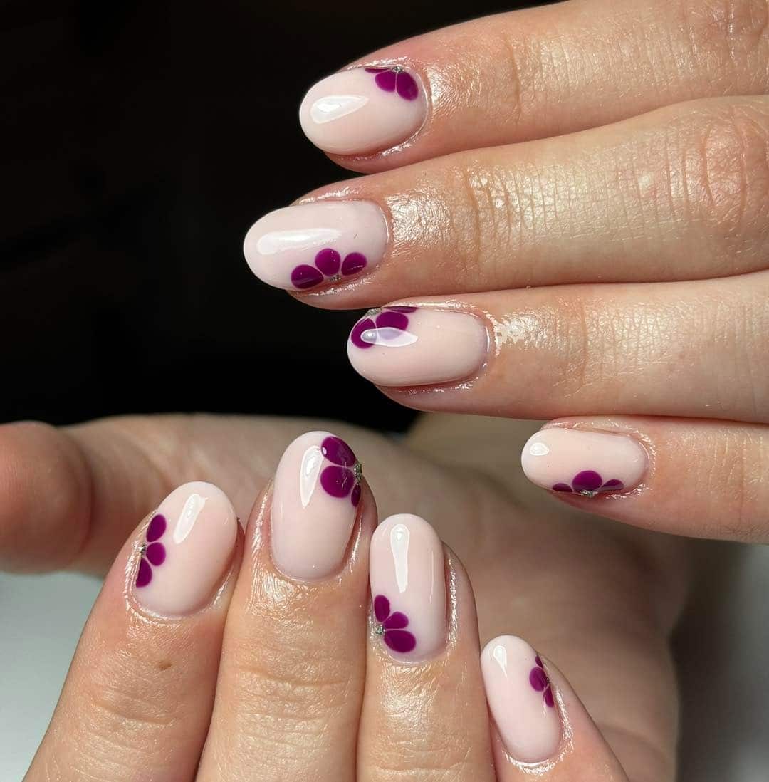 20. Violet Petal Accent Nails - short rounded nail ideas