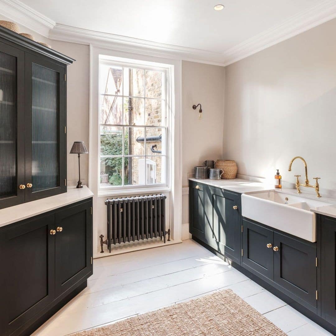 1. Classic Contrast with Charcoal Cabinetry - white kitchen floor ideas