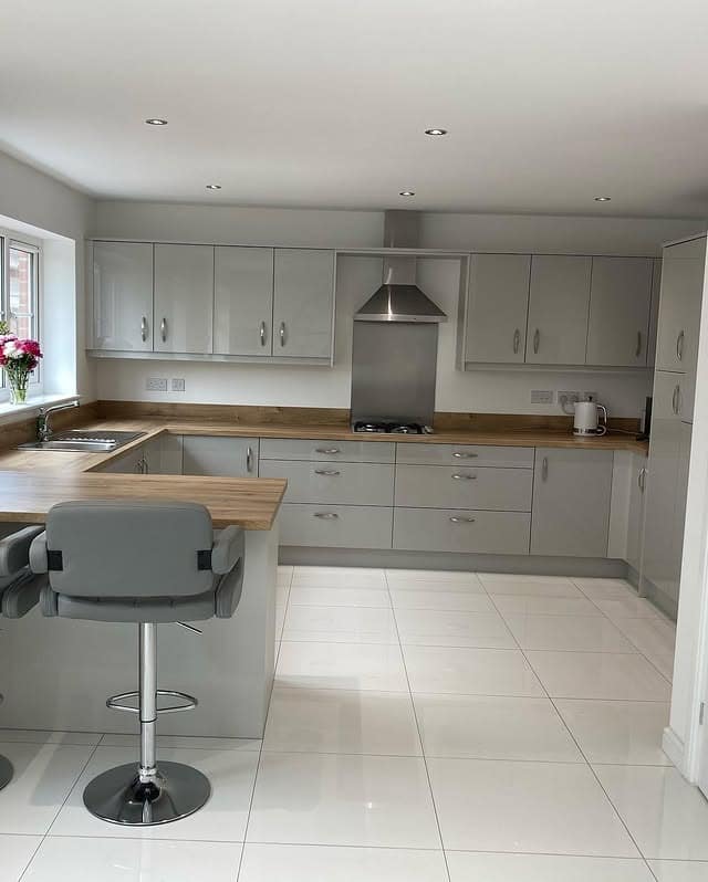 13. Soft Grey Modernity with Natural Warmth - white kitchen floor ideas