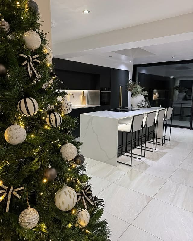 17. Monochrome Magic with Seasonal Charm - white kitchen floor ideas