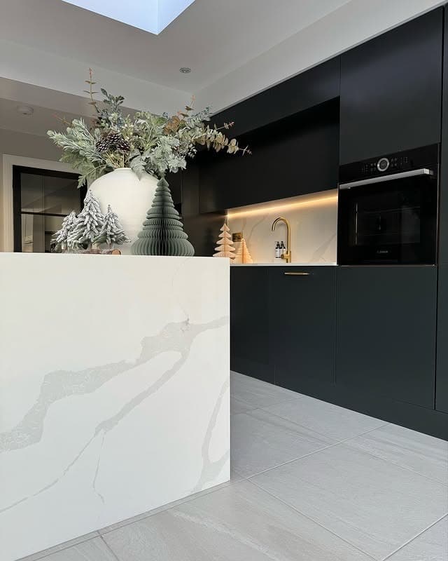 19. Dark Drama with Marble Accents - white kitchen floor ideas