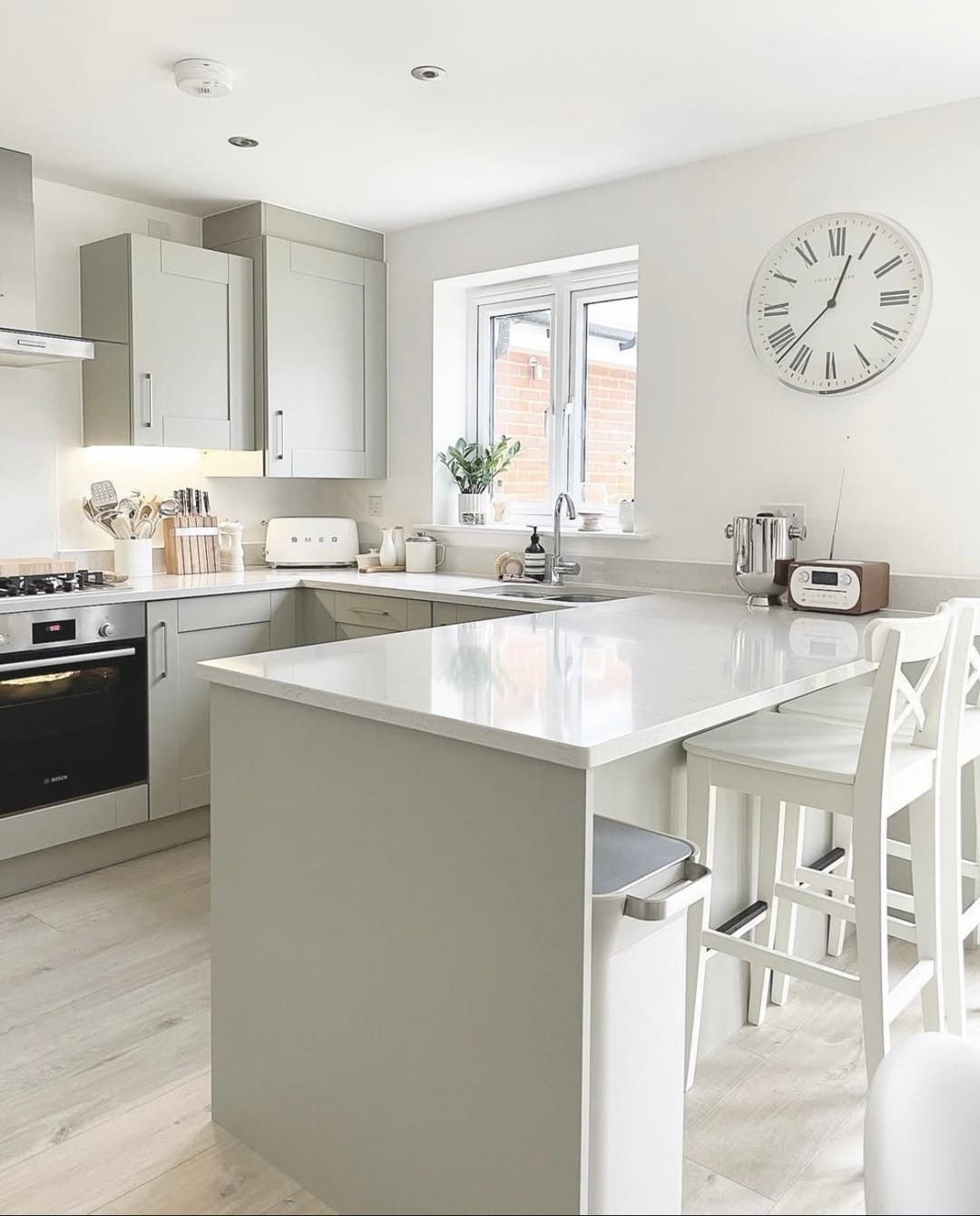21. Soft Sage and White Minimalist Kitchen - white kitchen floor ideas