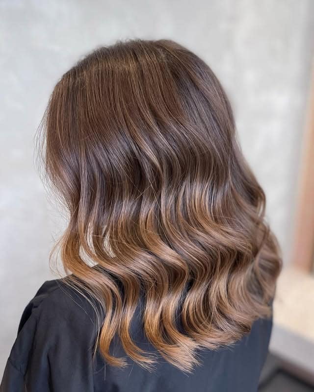 1. Soft Chestnut Waves with Subtle Shine - Medium Brown Hair Color