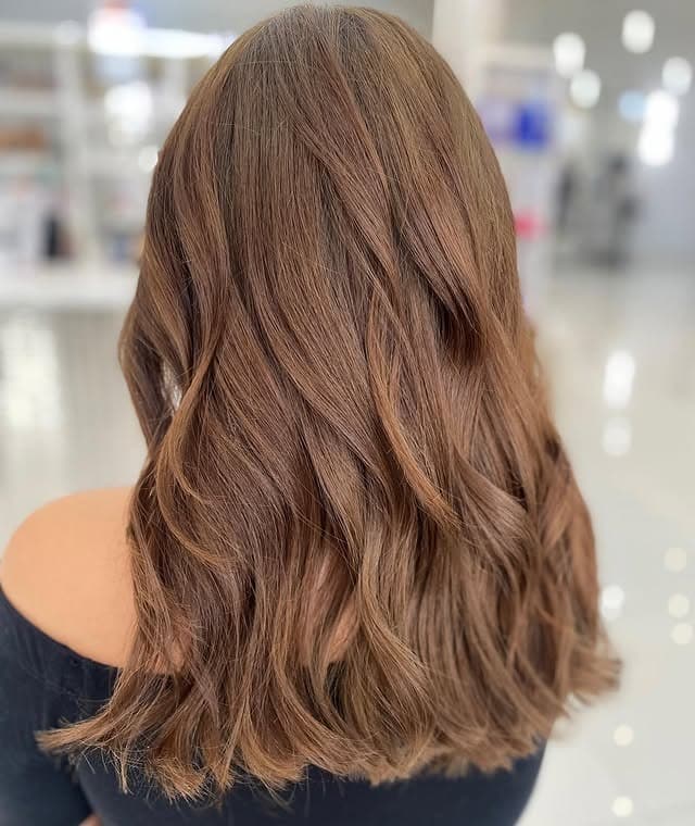 3. Classic Medium Brown with Polished Curls - Medium Brown Hair Color