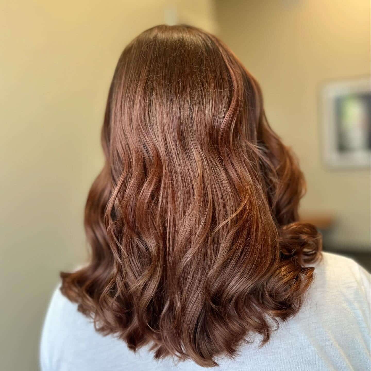 6. Glossy Cinnamon Brown Waves - Medium Brown Hair Color