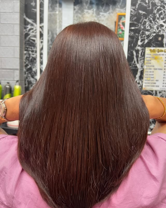 12. Sleek Mahogany Brown Perfection - Medium Brown Hair Color
