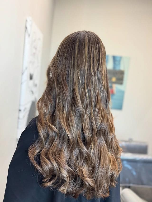 20. Golden Brown Waves with Seamless Highlights - Medium Brown Hair Color