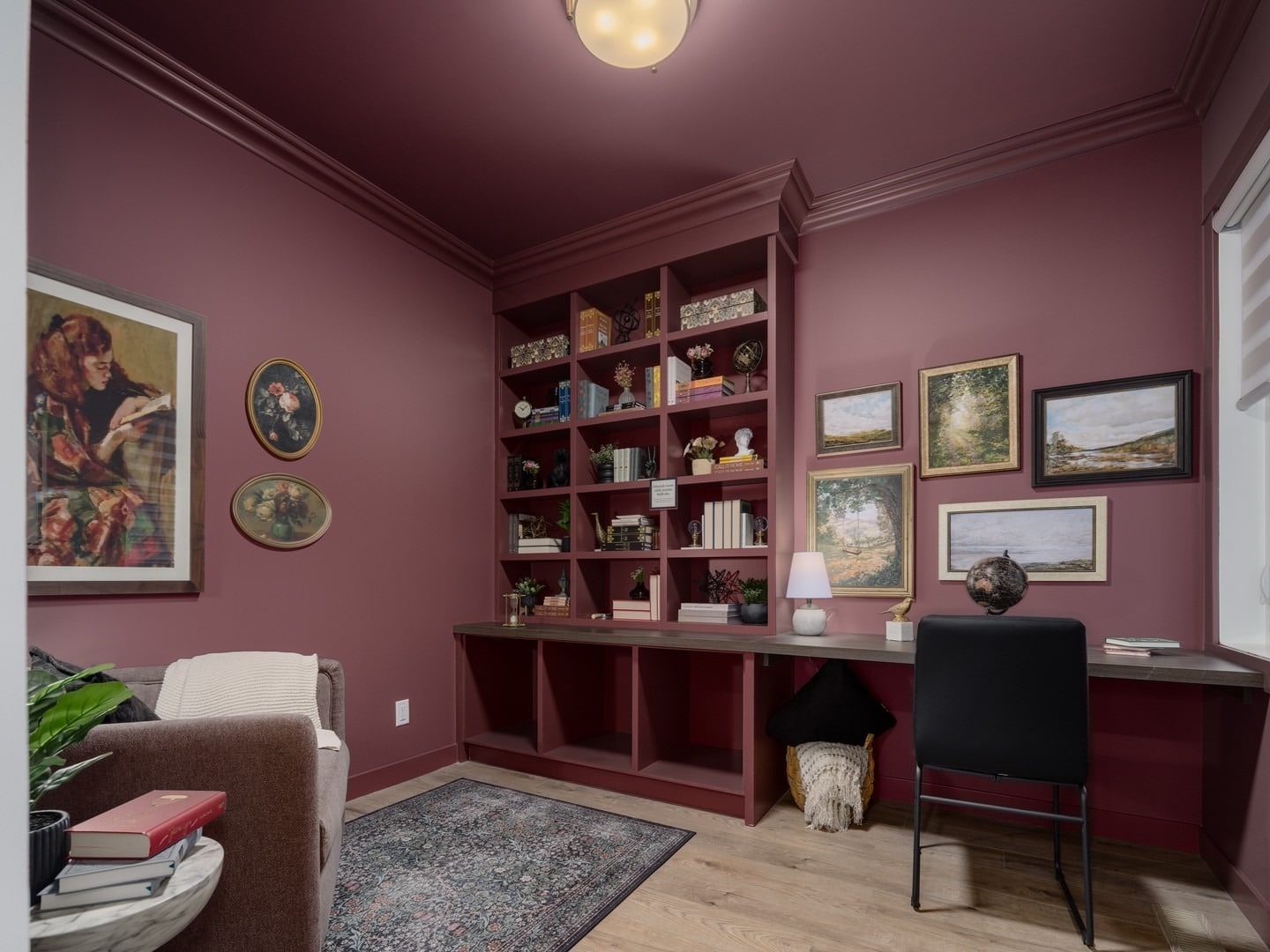 2. Moody Elegance with a Library Touch - guest bedroom office ideas