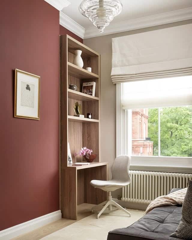 5. Compact Corner with Warm Terracotta Walls - guest bedroom office ideas