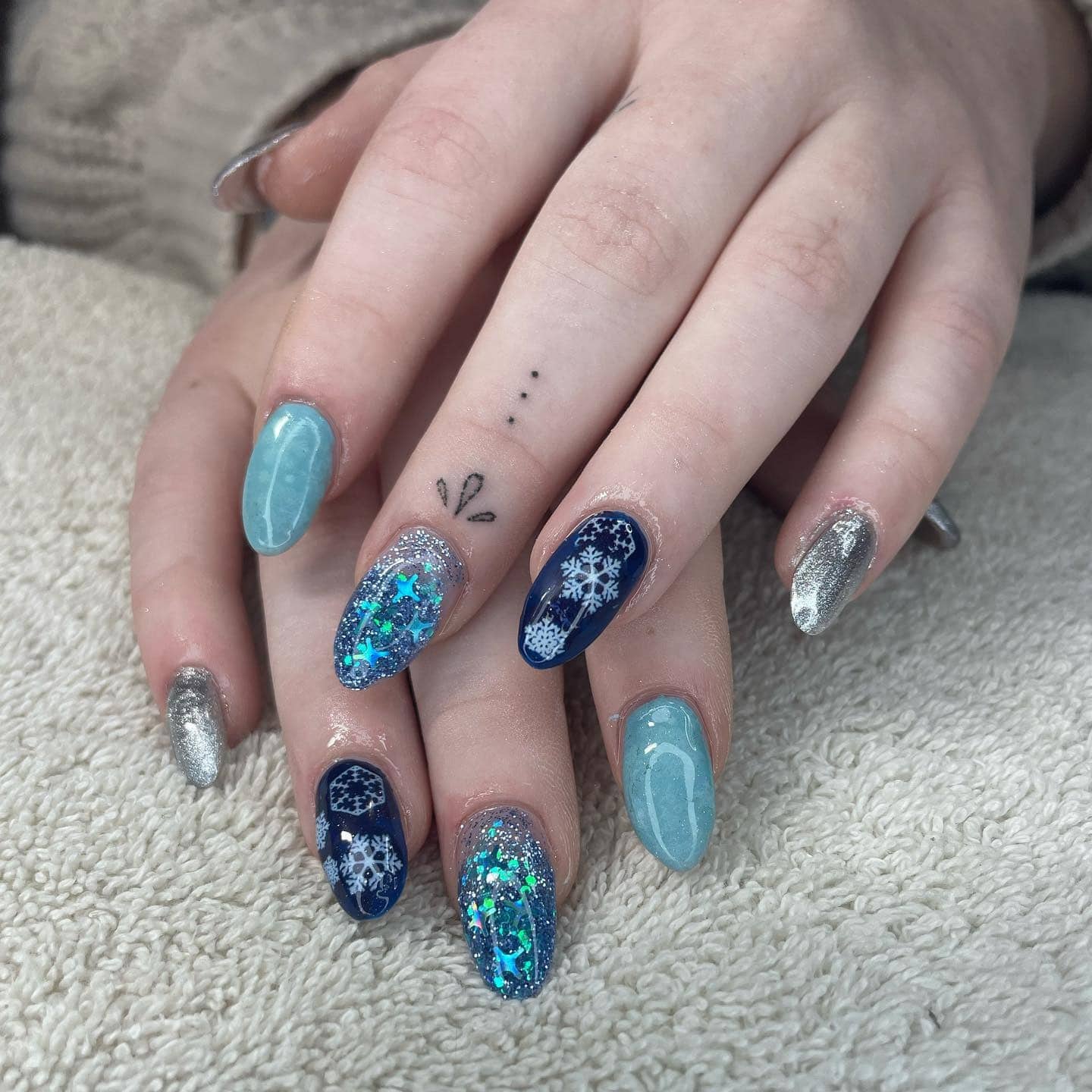 1. Frosted Ice Queen Nails - silver and blue nail ideas