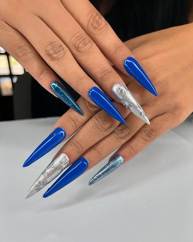 2. Electric Sapphire Stiletto Nails - silver and blue nail ideas
