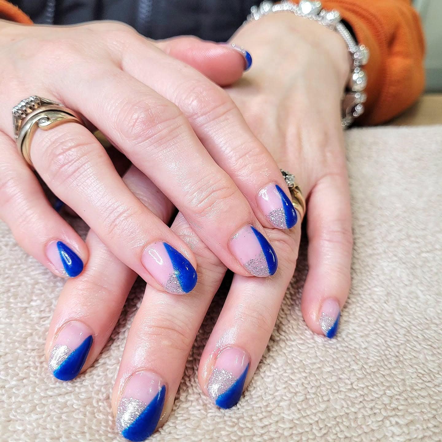 4. Blue Spark Arc French Nails - silver and blue nail ideas