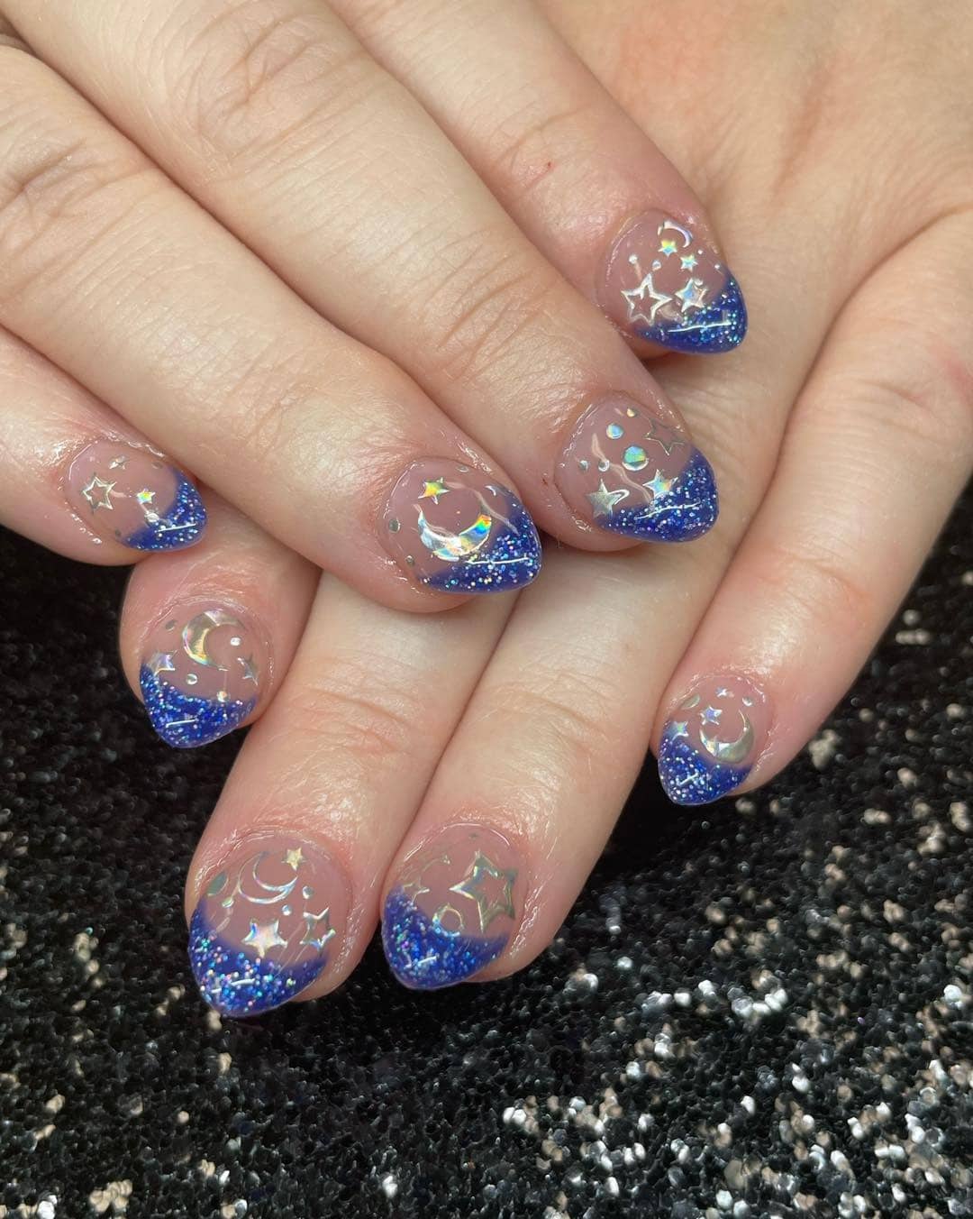 5. Celestial Blue Glitter Tips - silver and blue nail ideas