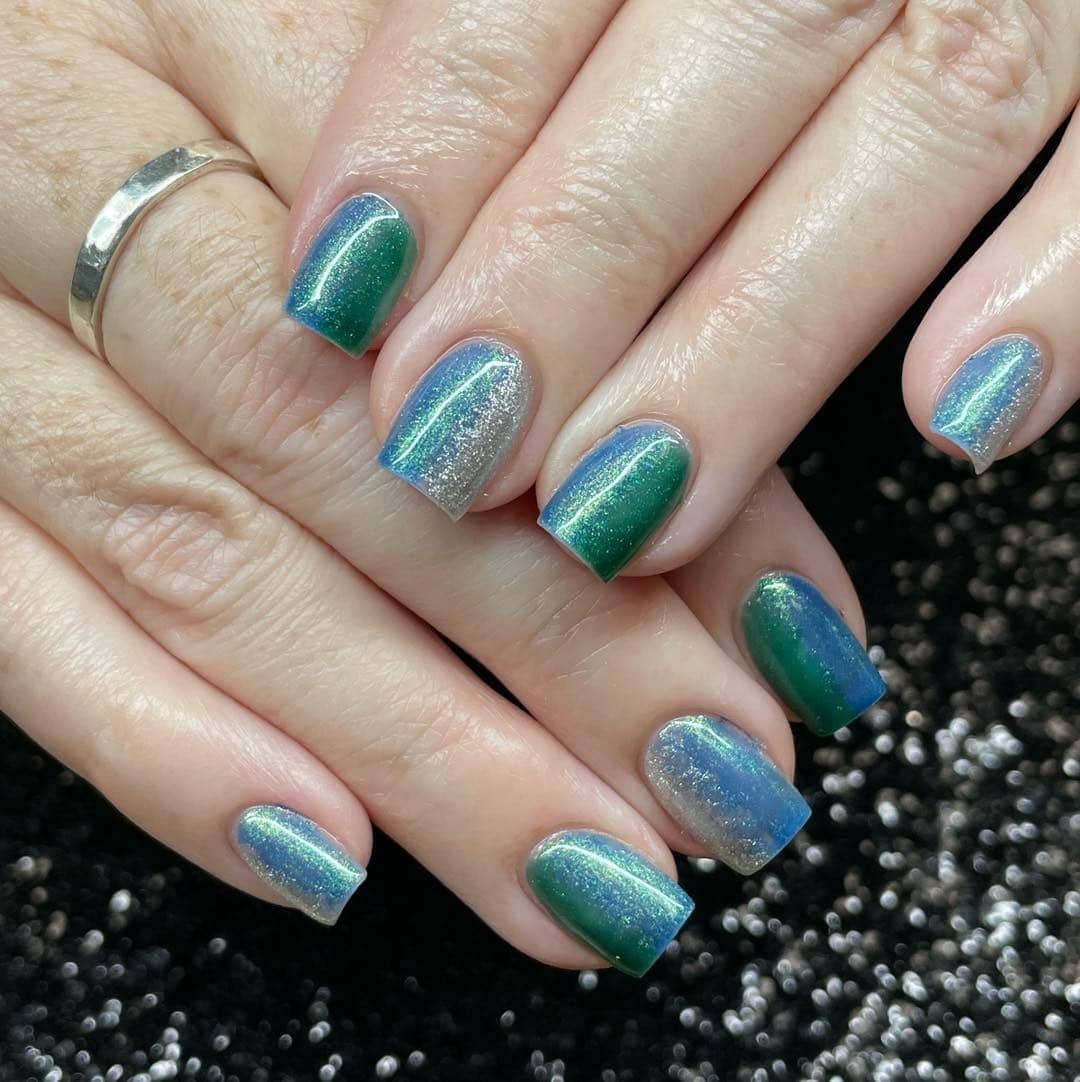 6. Aurora Chrome Nails - silver and blue nail ideas