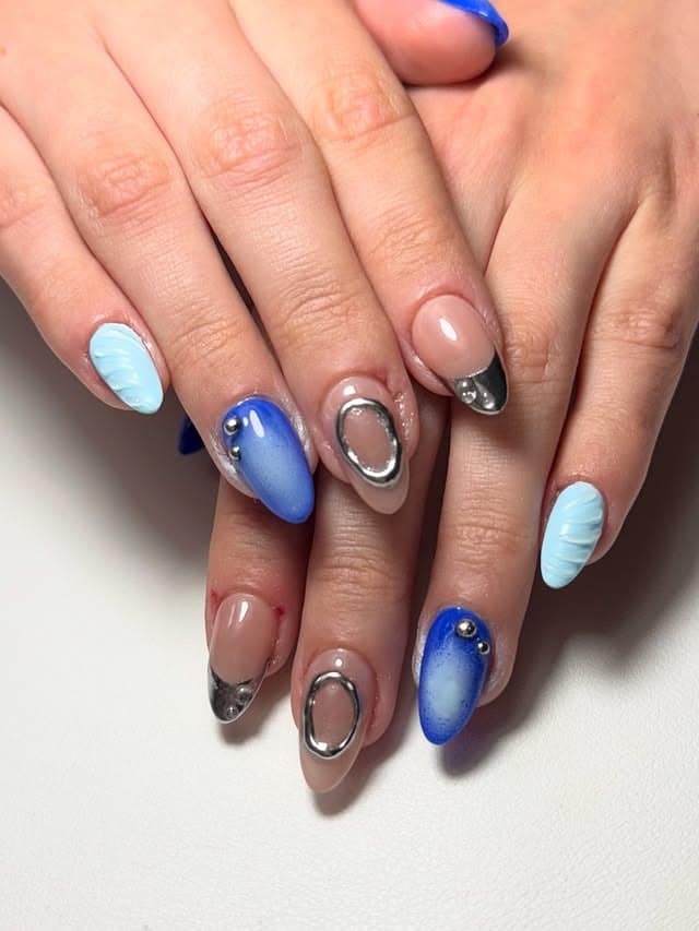 7. Futuristic Sky Nails - silver and blue nail ideas