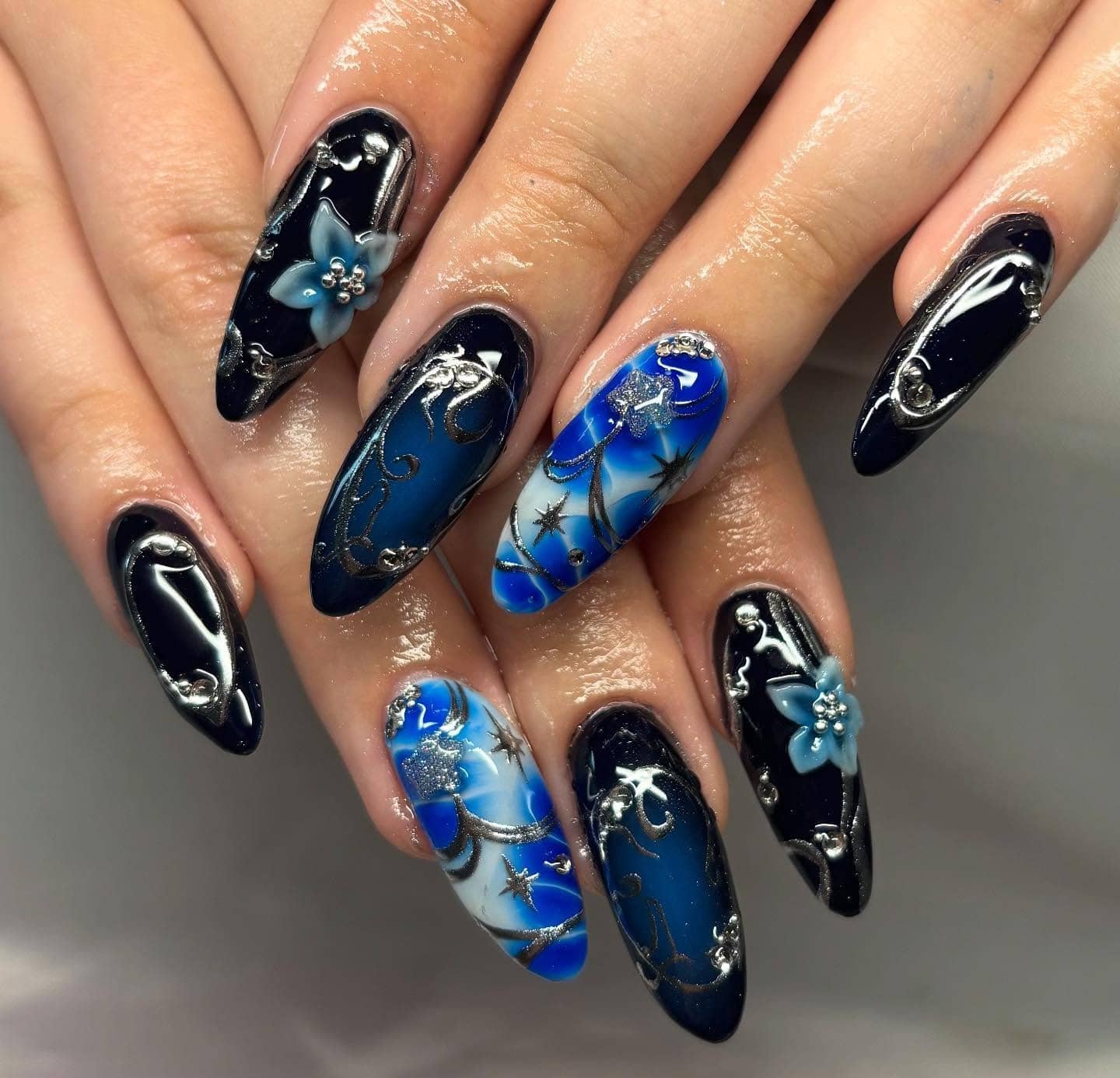 8. Enchanted Night Sky Nails - silver and blue nail ideas