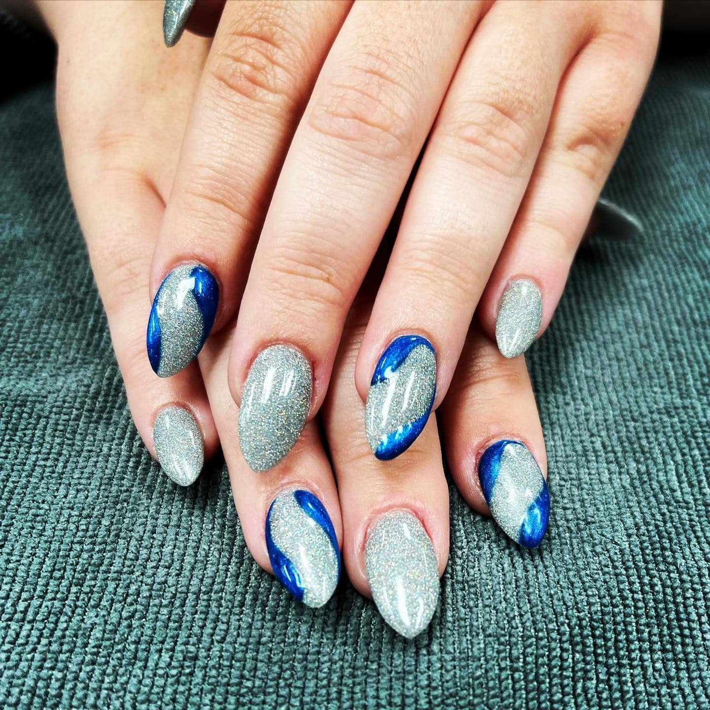9. Silver Wave Mirage Nails - silver and blue nail ideas