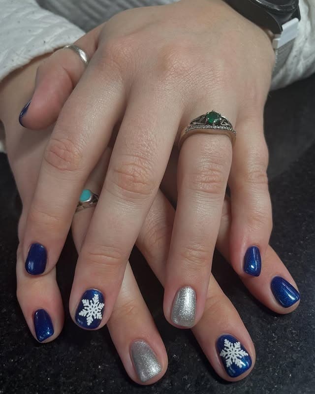 14. Snow Crystal Chic Nails - silver and blue nail ideas