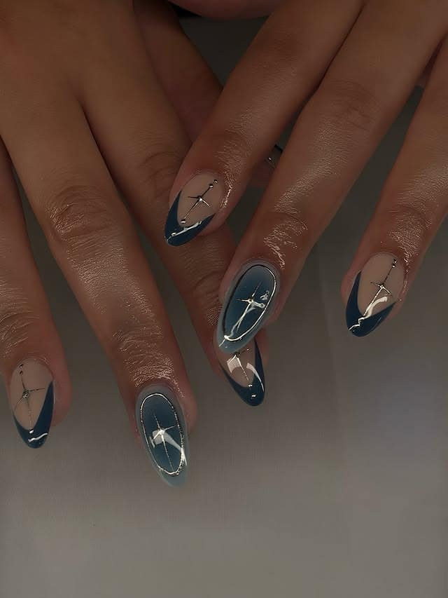 21. Silver-Trimmed Blue Eclipse Nails - silver and blue nail ideas